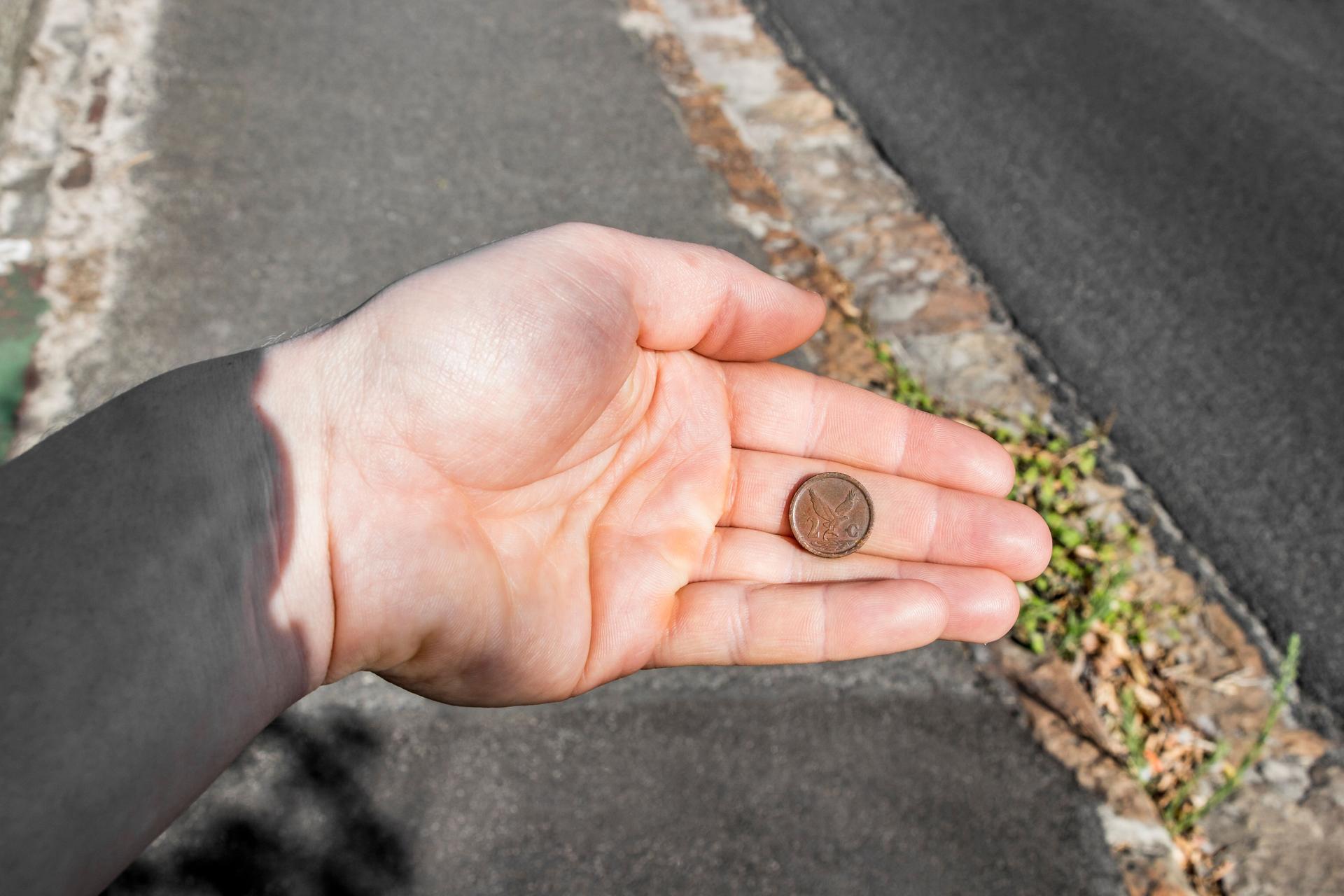 Old dirty coin found. In the hand. South Africa.