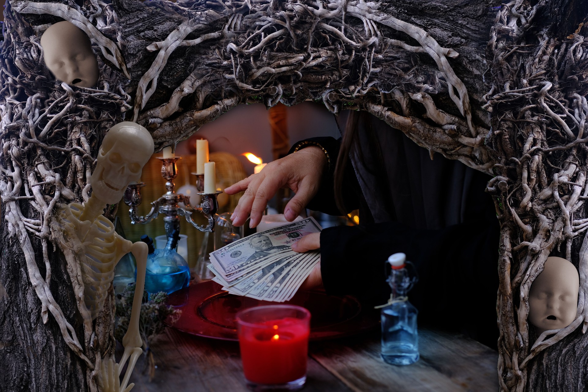 seance in salon of soothsayer, female hands of psychic doing witchcraft passes with money, esoteric Oracle performs ritual of removing spell of black magic, esoteric business, magic to increase income